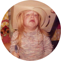 Carrie as a child with a humidifier on her head